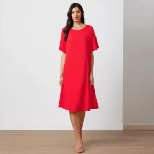 Model wearing a stylish loose-paneled dress in a sunny outdoor setting